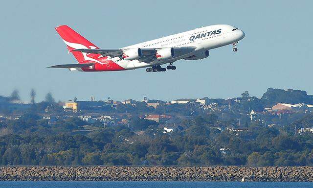 FILE PHOTO - Qantas flight QF1, an Airbus A380 aircraft, takes off from Sydney International Airport en route to Dubai, above Botany Bay
