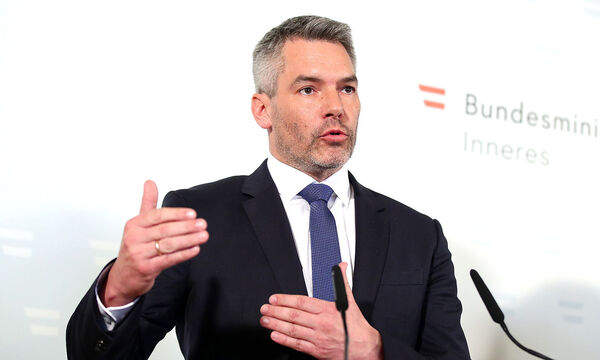 Austrian Interior Minister Karl Nehammer attends a news conference in Vienna