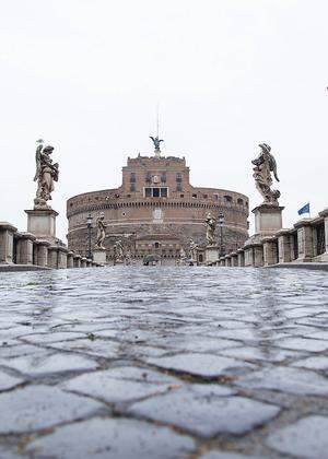 Italy: Rome in the rain during Covid-19 lockdown Views of Sant Angelo bridge with Castel Sant Angelo in the rain during