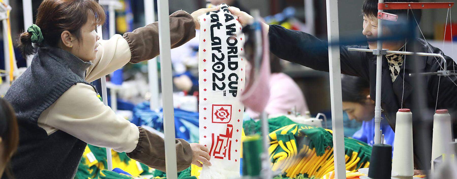 China, Produktion von Fans-Schals fuer die Fuszball WM RECORD DATE NOT STATED Workers are sorting out scarves for fans of