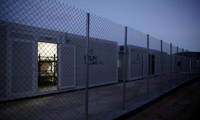 Containers to house migrants and refugees are placed in line at the migrant registration centre on the Greek island of Chios