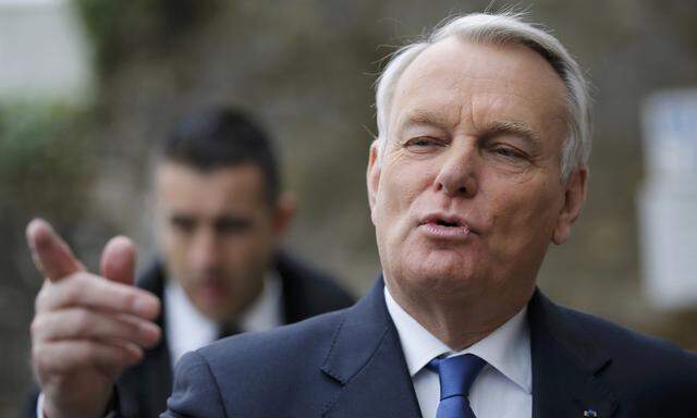 File photo of French Prime Minister Jean-Marc Ayrault leaving a polling station after casting his ballot during the second round in the French mayoral elections in Nantes
