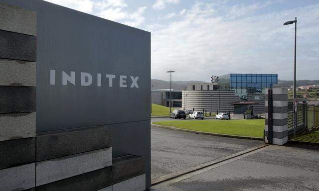 An Inditex logo is seen at the entrance of a Zara factory, the headquarters of Inditex group, in Arteixo