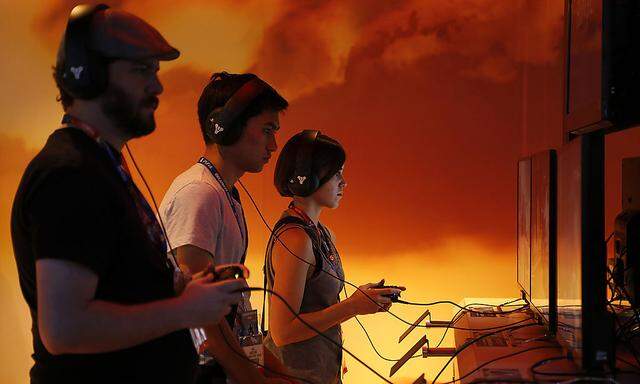 Gamers play a game by Bungie Inc. at the 2014 Electronic Entertainment Expo, known as E3, in Los Angeles