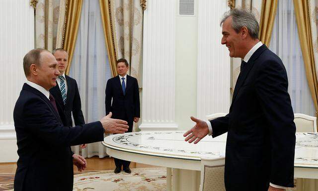 Putin greets Austrian oil and gas group OMV CEO Seele during their meeting at Kremlin in Moscow