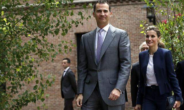Spain's Crown Prince Felipe and his wife Princess Letizia walk before the annual meeting of the board of directors of the Students Residence in Madrid