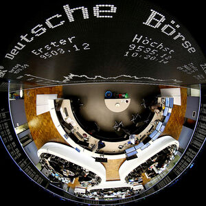 FILE PHOTO: The German share prize index board and the trading room of Frankfurt's stock exchange are photographed with a circular fisheye lens during afternoon trading session in Frankfurt