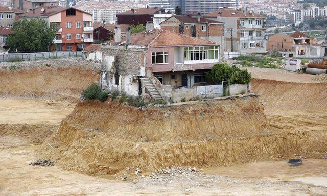 A lone house is seen at a construction site of an urban transformation project in Fikirtepe