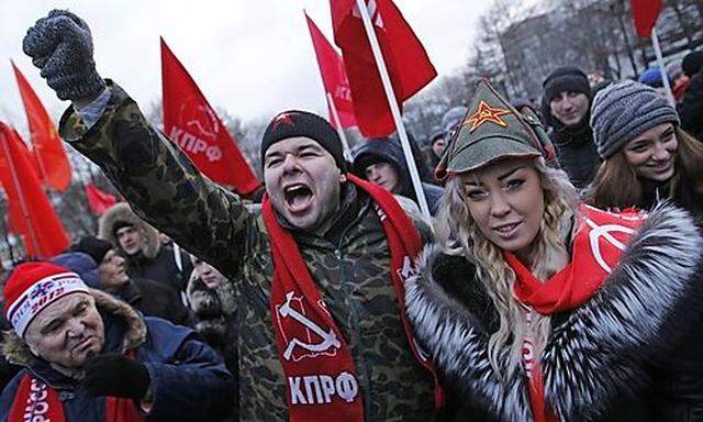 Communist party supporters hold a rally against results of presidential election in Moscow, Russia, M