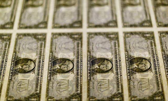 FILE PHOTO: United States one dollar bills seen on a light table at the Bureau of Engraving and Printing in Washington