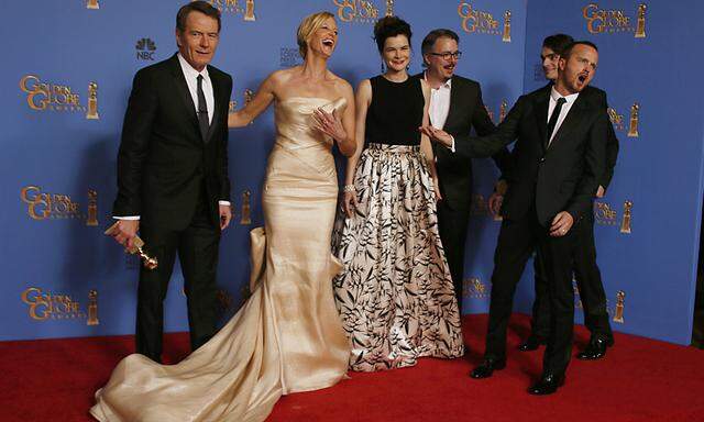 The cast of the drama series ´Breaking Bad´ pose backstage after they won the award for Best TV Series, Drama at the 71st annual Golden Globe Awards in Beverly Hills