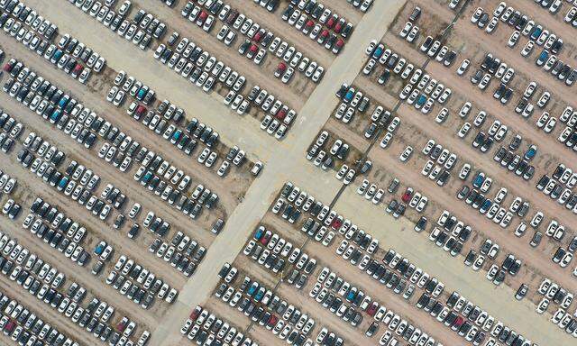 Nissan cars are seen at a storage area in Guangzhou, Guangdong