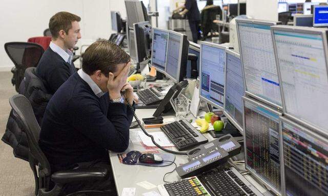 Traders react on the IG Group trading floor in London