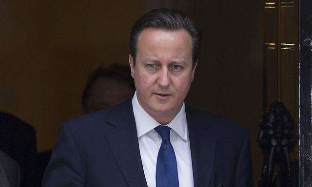 Britain´s Prime Minister David Cameron leaves Number 10 Downing Street to attend Prime Minister´s Questions at parliament in London