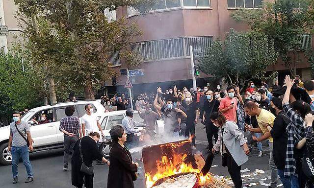 October 20, 2022, Tehran, Iran: A picture obtained by ZUMA outside Iran, reportedly shows protesters set fire as they cl