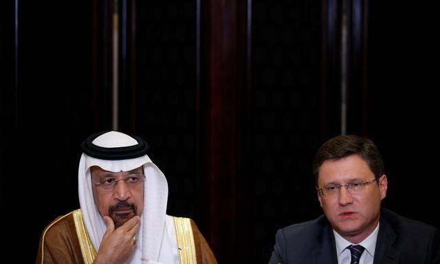 Saudi Arabia´s Energy Minister Khalid al-Falih and Russia´s Energy Minister Alexander Novak attend a joint briefing in Beijing