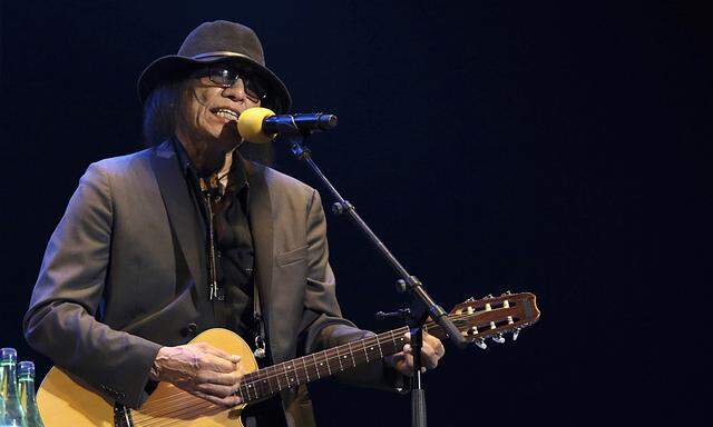American folk singer Sixto Rodriguez performs on stage in Cape Town