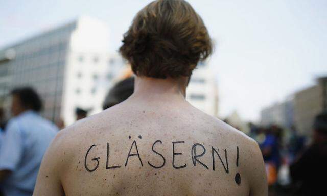 A protester takes part in demonstration against NSA and in support of whistleblower Snowden in Frankfurt