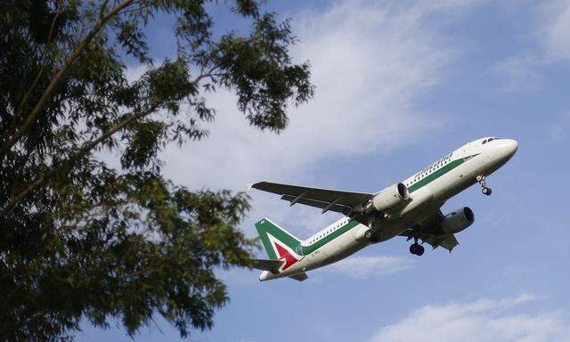 An Alitalia plane approaches to land at Fiumicino international airport in Rome