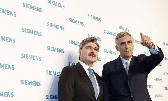 Siemens CEO Loescher and CFO Kaeser arrive for annual news conference in Munich