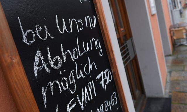 A sign reading 'Take away only from October 27' is seen in the city center prior to an ordered lock-down due to the further spreading of the coronavirus disease (COVID-19) in Pfarrkirchen