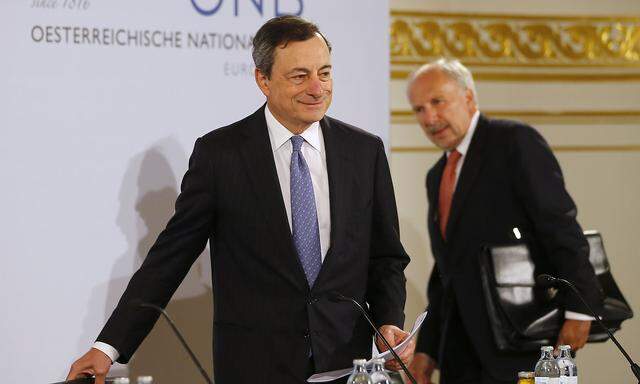 ECB President Draghi and ECB member Nowotny arrive for news conference in Vienna