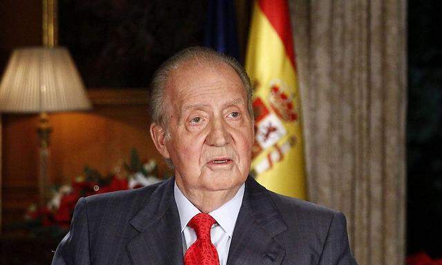 Spanish King Juan Carlos speaks during his traditional Christmas message at Zarzuela Palace in Madrid