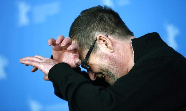 Director Lars von Trier reacts during a photocall to promote the movie ´Nymphomaniac Volume I´ during the 64th Berlinale International Film Festival in Berlin