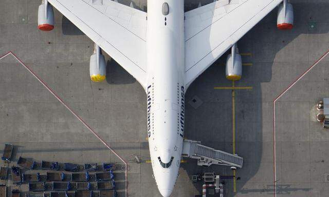 File aerial photo shows a Lufthansa plane parked on the tarmac of the closed Frankfurt's airport