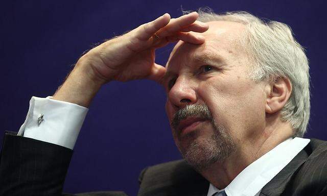 European Central Bank Governing Council member Nowotny listens to questions at a retail investor conference in Vienna