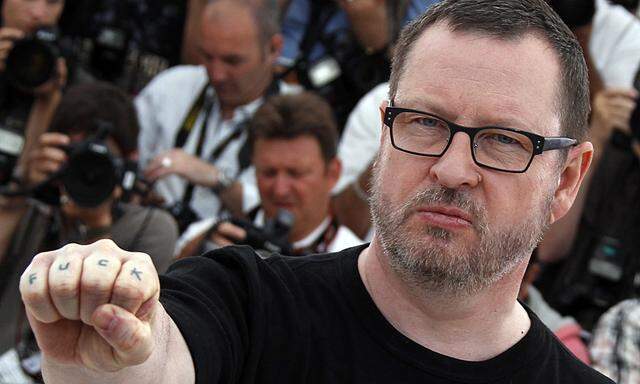 Director Von Trier poses during a photocall for the film Melancholia at the 64th Cannes Film Festival