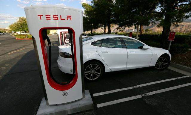 A Tesla Model S charges at a Tesla Supercharger station in Cabazon, California