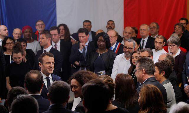 French President Emmanuel Macron attends a meeting with elected officials and local association members as part of the 'Great National Debate' in Evry-Courcouronnes