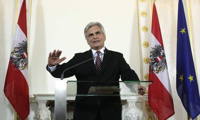 Austrian Social Democratic Chancellor Faymann addresses a news conference after a cabinet meeting in Vienna