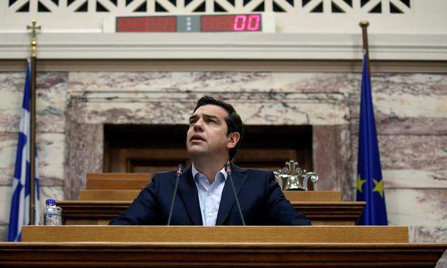 Greek PM Tsipras addresses his lawmakers during a ruling Syriza party parliamentary group session in Athens
