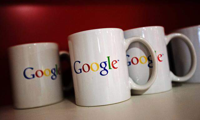 Coffee cups with Google logos are seen at the new Google office in Toronto