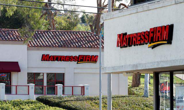 FILE PHOTO: Two Mattress Firm stores lie on either side of the street in Encinitas, California,