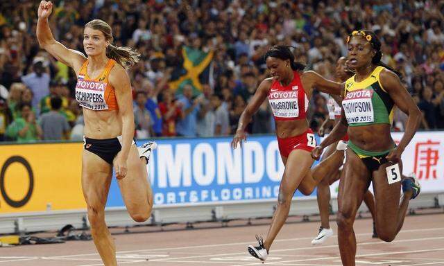 Dafne Schippers of the Netherland runs to win the women's 200m final ahead of Elaine Thompson of Jamaica during the 15th IAAF World Championships at the National Stadium in Beijing