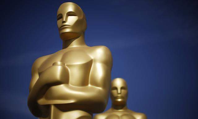 Oscar statues stand in a parking lot near the Dolby Theater during preparations ahead of the 87th Academy Awards in Hollywood