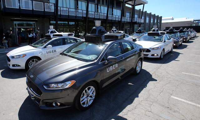 A fleet of Uber´s Ford Fusion self driving cars are shown during a demonstration of self-driving automotive technology in Pittsburgh