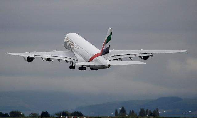 FILE PHOTO: An Emirates Airbus A380-800 aircraft takes off from Manchester Airport in Manchester