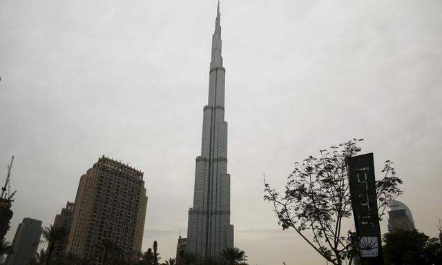 A flag for property company EMAAR is seen near the Burj Khalifa, the tallest building in the world, in Dubai