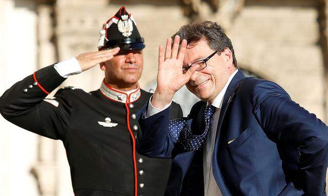 FILE PHOTO: Italy's Undersecretary for Prime Minister Giancarlo Giorgetti arrives for gala dinner at the Quirinal palace in Rome