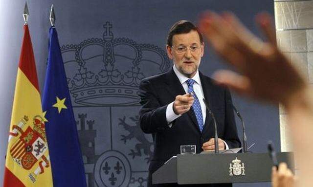 Spain's PM Rajoy takes questions during a news conference at Madrid's Moncloa Palace