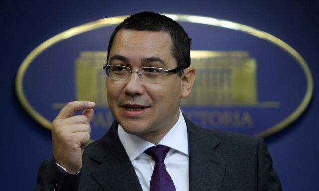 File picture shows Romania's Prime Minister Victor Ponta gesturing during a news conference at Victoria palace in Bucharest