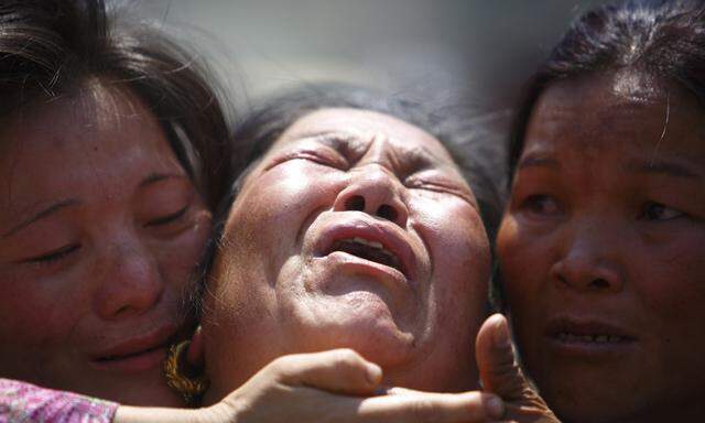 Family member a Sherpa climber is comforted by her relatives during a funeral rally of Nepali Sherpa climbers in Kathmandu