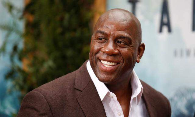 Former NBA basketball player Earvin Magic Johnson poses at the premiere of the movie ´The Legend of Tarzan´ in Hollywood