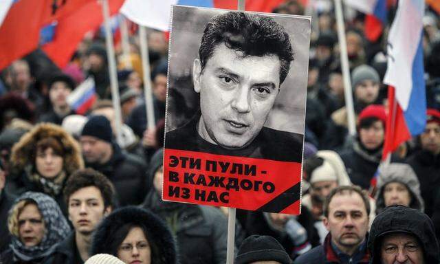 A portrait of Kremlin critic Boris Nemtsov, who was shot dead on Friday night, is seen during a march to commemorate him in central Moscow