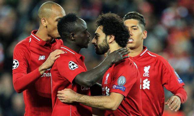 Liverpool s Mohamed Salah celebrates after scoring his teams third goal during the UEFA Champions Le