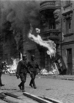 Photograph of a patrol of SS men on Nowolipie Street during the Warsaw Ghetto Uprising Dated 1943 W